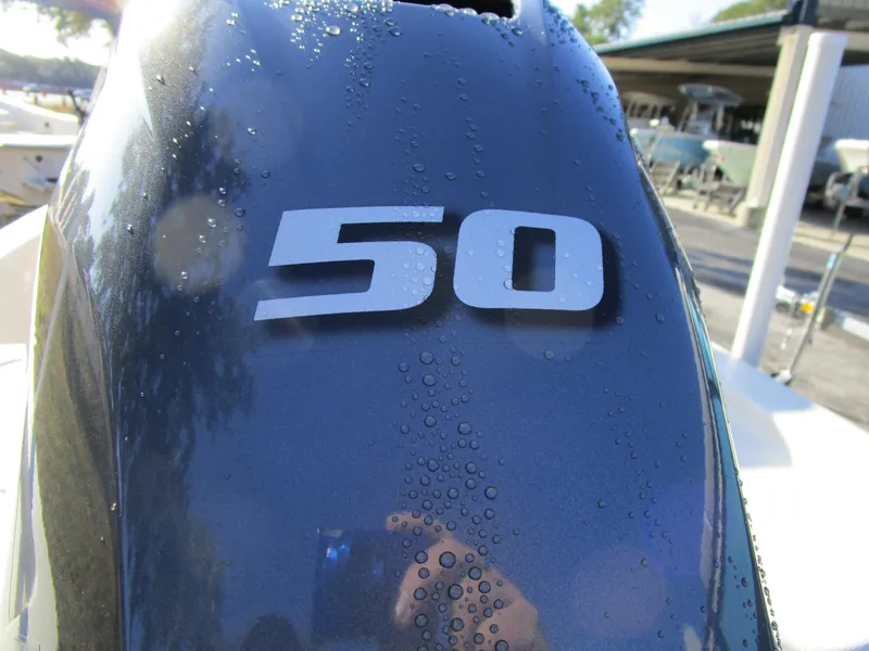 Slide: The Image of Close-up of a 50 HP outboard motor on a 2024 Carolina Skiff E16 JVX CC. - 4