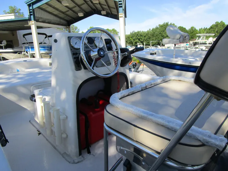 Slide: The Image of 2024 Carolina Skiff E Series E16 JVX CC boat interior with steering console. - 9