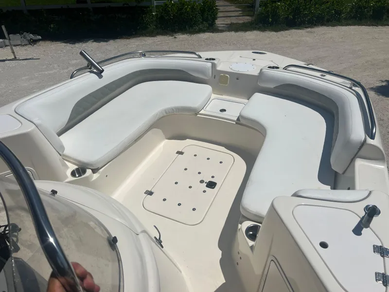 Slide: The Image of 2007 Hurricane 231 boat with white seating and spacious deck. - 12