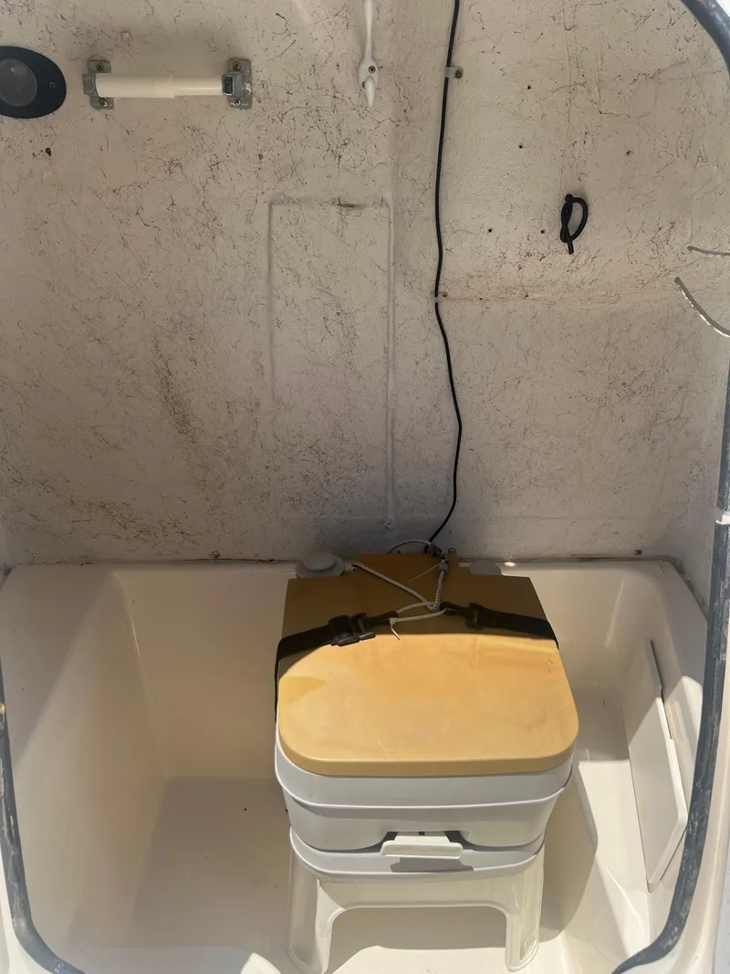 Slide: The Image of 2007 Hurricane 231 boat interior with portable toilet. - 13