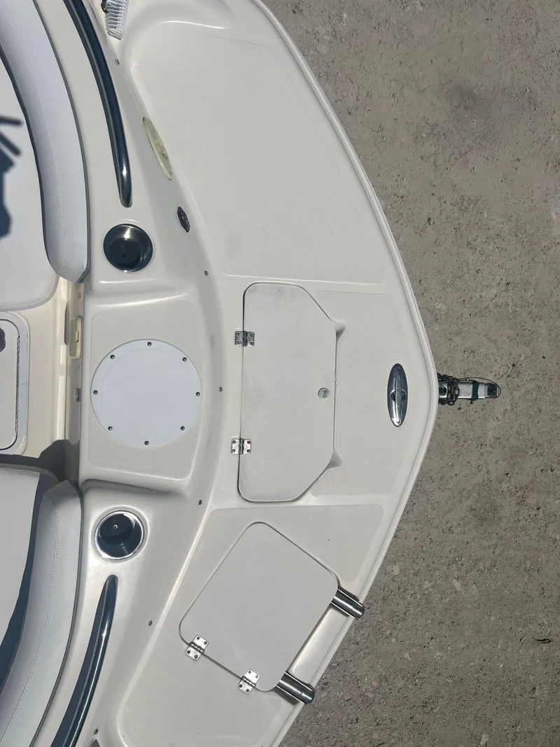 Slide: The Image of 2007 Hurricane 231 boat bow with storage compartments and seating. - 14