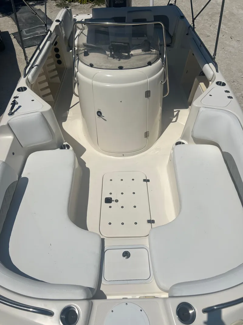 Slide: The Image of 2007 Hurricane 231 boat interior with seating and console. - 17
