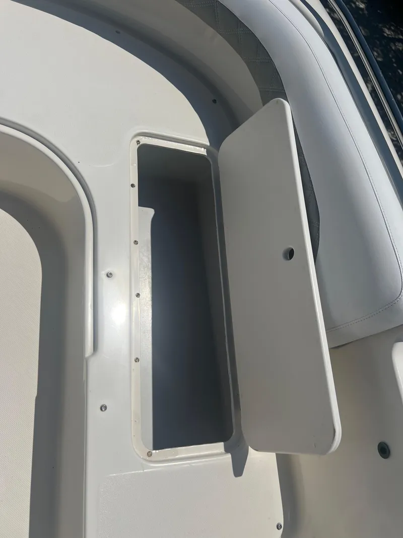 Slide: The Image of Open storage compartment on a 2007 Hurricane 231 boat. - 19