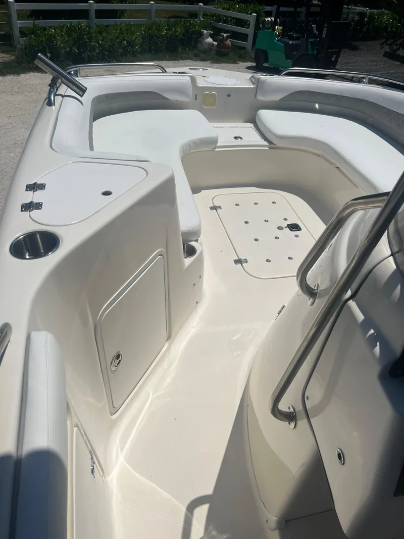 Slide: The Image of 2007 Hurricane 231 boat interior with seating and storage compartments. - 21
