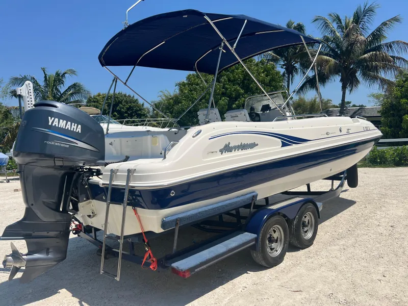 Slide: The Image of 2007 Hurricane 231 boat with Yamaha outboard motor on trailer. - 25