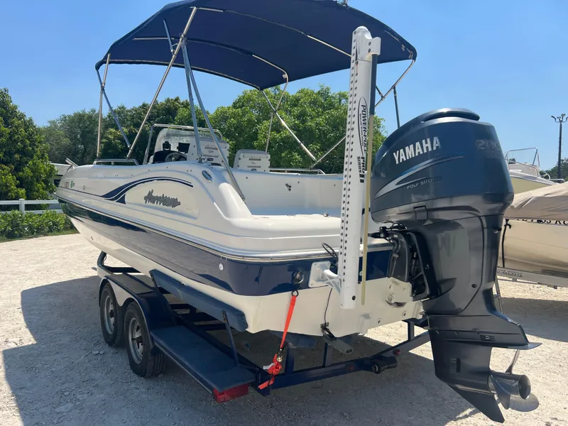 Slide: The Image of 2007 Hurricane 231 boat with Yamaha outboard motor on trailer. - 27