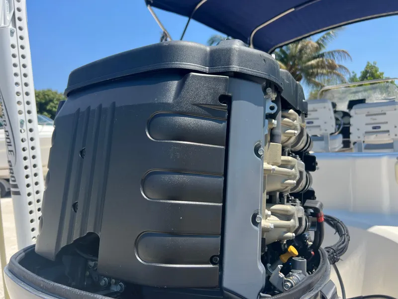 Slide: The Image of Close-up of a 2007 Hurricane 231 boat engine under a blue canopy. - 29