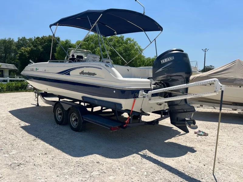 Slide: The Image of 2007 Hurricane 231 boat with Yamaha outboard motor on trailer. - 32