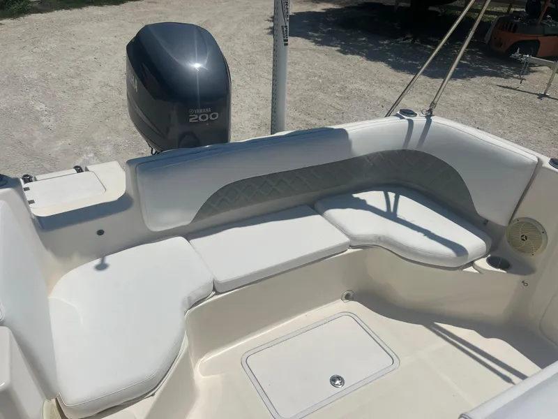 Slide: The Image of 2007 Hurricane 231 boat with Yamaha 200 engine, featuring white cushioned seating. - 39