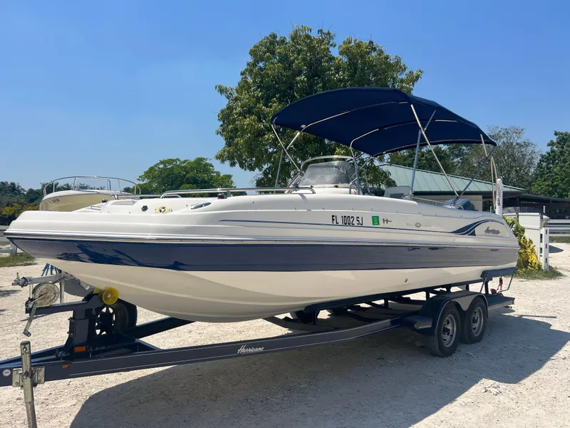 Slide: The Image of 2007 Hurricane 231 boat on a trailer with a blue canopy. - 4
