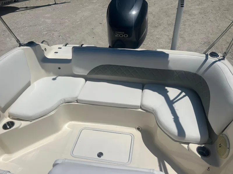 Slide: The Image of 2007 Hurricane 231 boat with Yamaha 200 outboard motor, white seating area. - 40