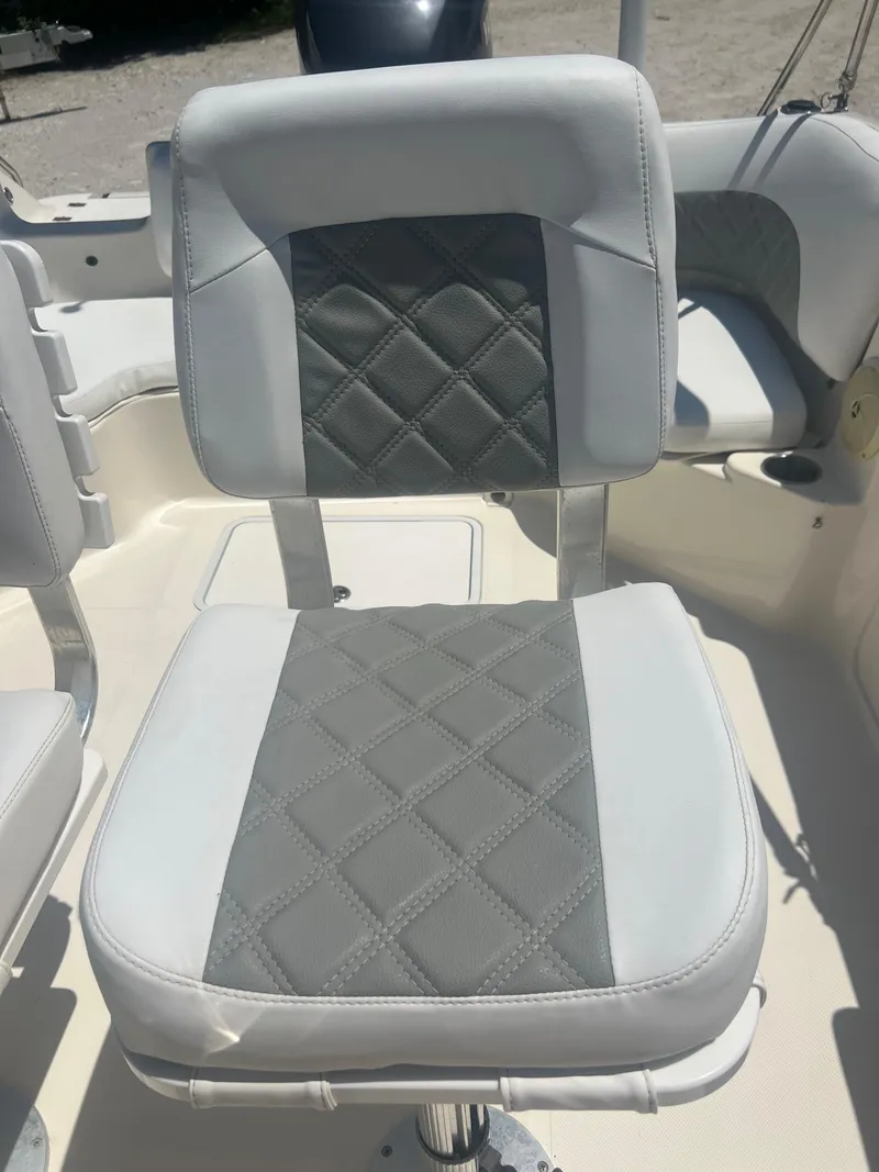 Slide: The Image of 2007 Hurricane 231 boat seat with gray and white diamond-stitched upholstery. - 41