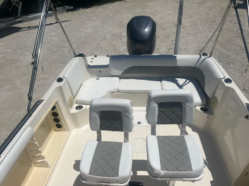 Slide: The Image of 2007 Hurricane 231 boat interior with seating and outboard motor. - 43