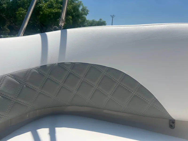 Slide: The Image of Close-up of 2007 Hurricane 231 boat's white and gray quilted upholstery. - 45