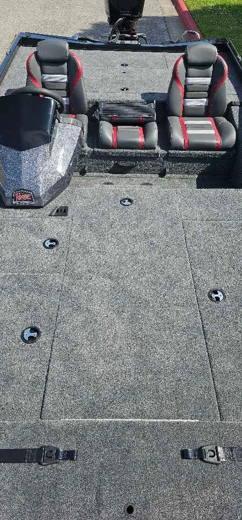 Slide: The Image of 2024 Ranger RT198P boat interior with dual seats and spacious deck. - 4