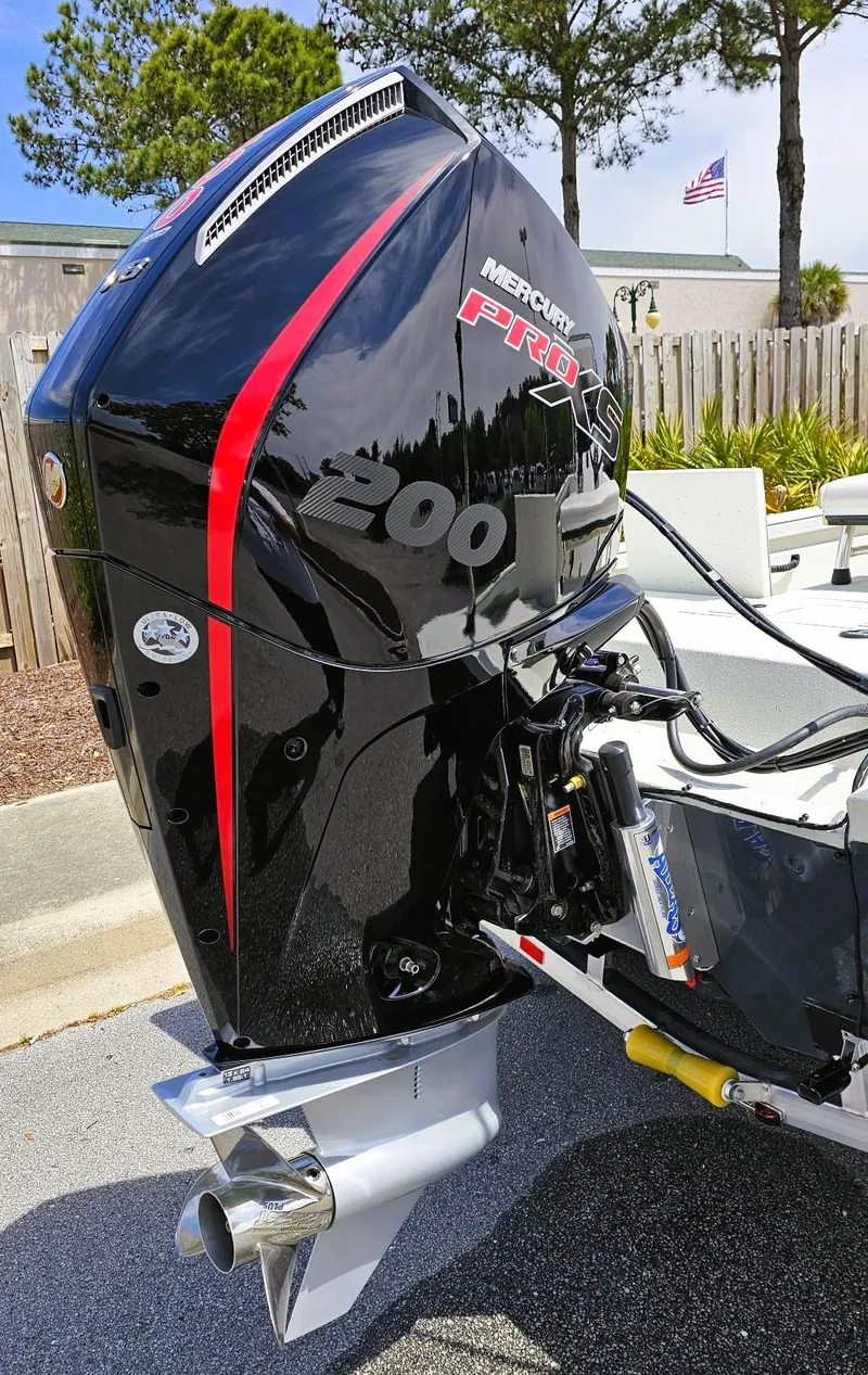 Slide: The Image of 2024 Ranger RB210 boat with a Mercury Pro XS 300 outboard motor. - 7