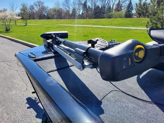 Slide: The Image of 2024 Tracker Pro 170 boat with trolling motor on a sunny day. - 2