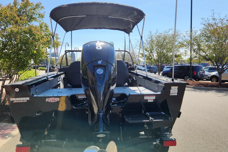 Slide: The Image of 2024 Tracker Targa V-18 WT boat with outboard motor and canopy. - 2