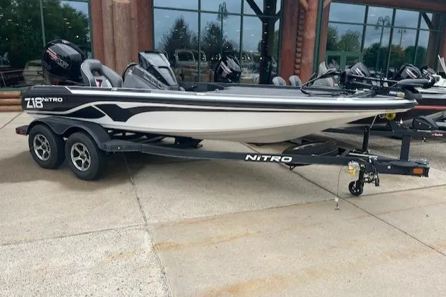 Slide: The Image of 2024 Nitro Z18 boat on a trailer, parked outdoors. - 0