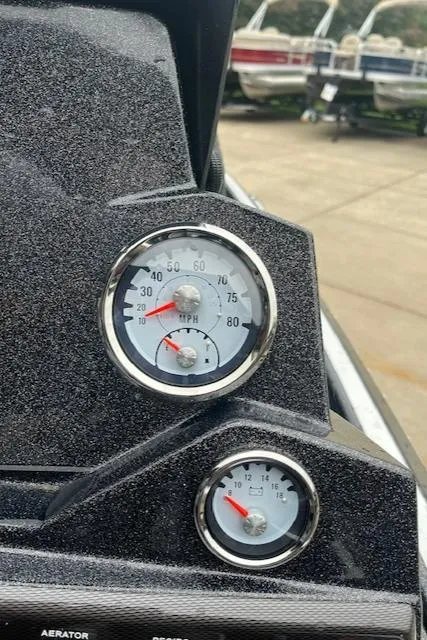 Slide: The Image of Close-up of 2024 Nitro Z18 boat dashboard with speedometer and fuel gauge. - 10