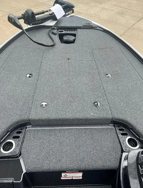 Slide: The Image of 2024 Nitro Z18 boat deck with storage compartments and fishing rod holders. - 2