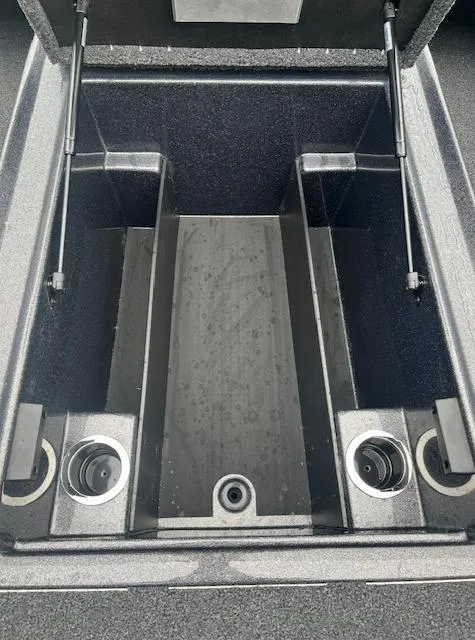Slide: The Image of 2024 Nitro Z18 boat storage compartment with hydraulic lift supports. - 4