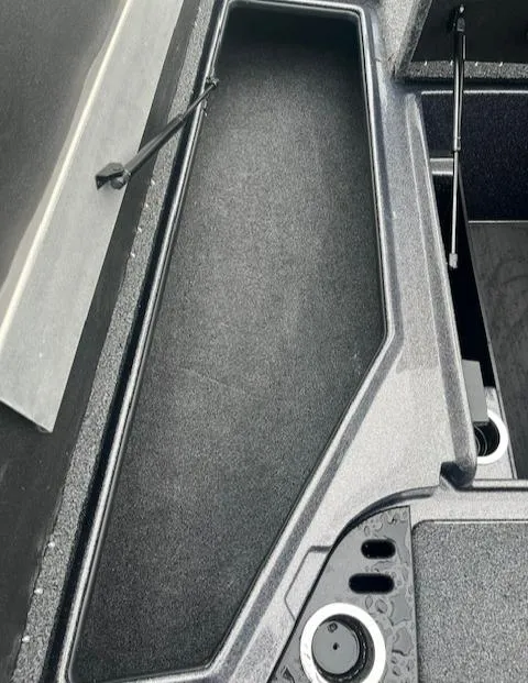 Slide: The Image of 2024 Nitro Z18 boat storage compartment with open lid. - 5