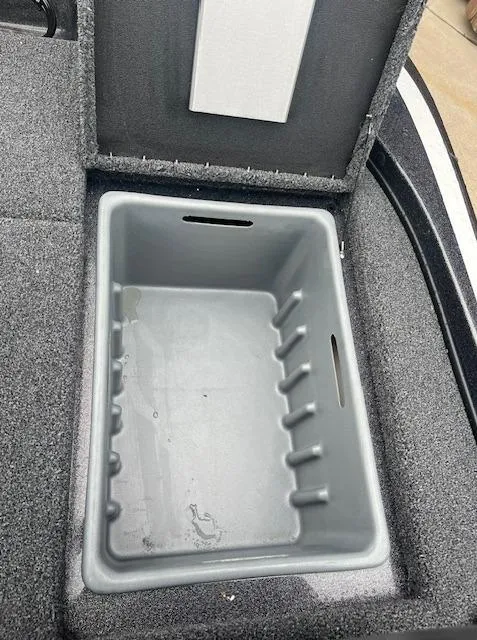 Slide: The Image of 2024 Nitro Z18 boat storage compartment with gray interior. - 6