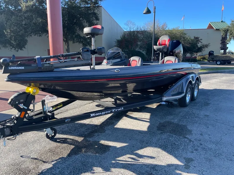 Slide: The Image of 2024 Ranger Z519 Ranger Cup Equipped boat on trailer in outdoor setting. - 1
