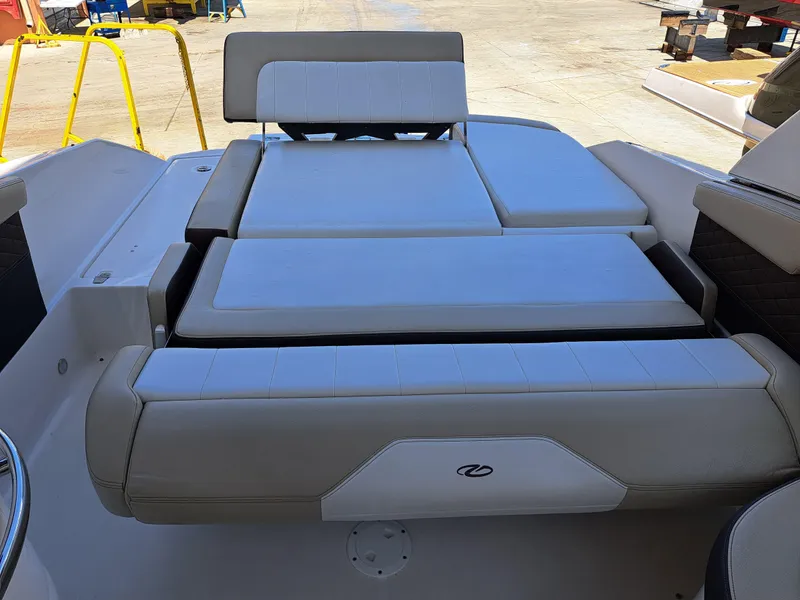Slide: The Image of 2014 Regal 2700 Bowrider boat with spacious sunpad and adjustable backrest. - 28