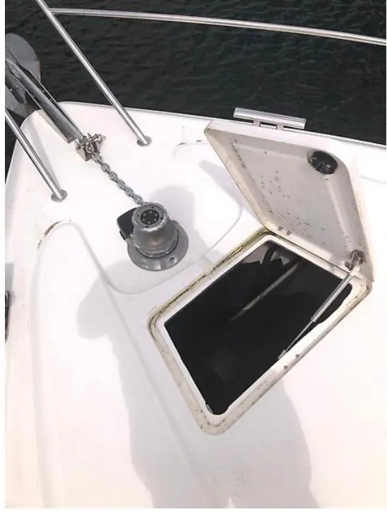 Slide: The Image of Deck of 1997 Sunseeker MANHATTAN yacht with open hatch and anchor chain. - 11