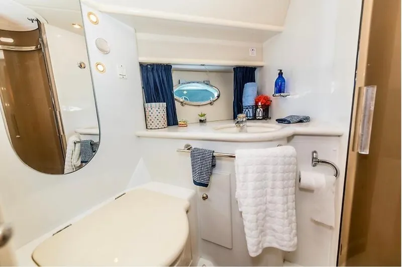 Slide: The Image of Luxurious bathroom in a 1997 Sunseeker MANHATTAN yacht, featuring elegant decor and modern amenities. - 12