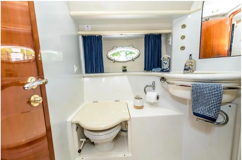 Slide: The Image of Luxurious 1997 Sunseeker MANHATTAN yacht bathroom with elegant fixtures and nautical decor. - 14
