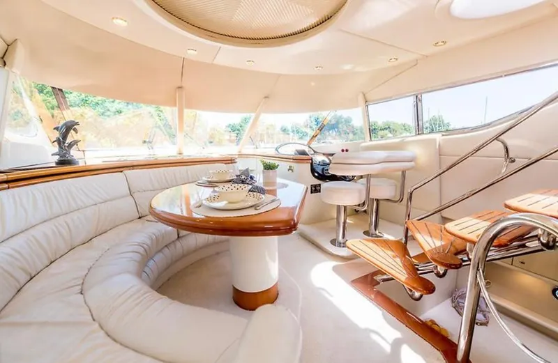 Slide: The Image of Luxurious 1997 Sunseeker MANHATTAN yacht interior with elegant seating and dining area. - 2