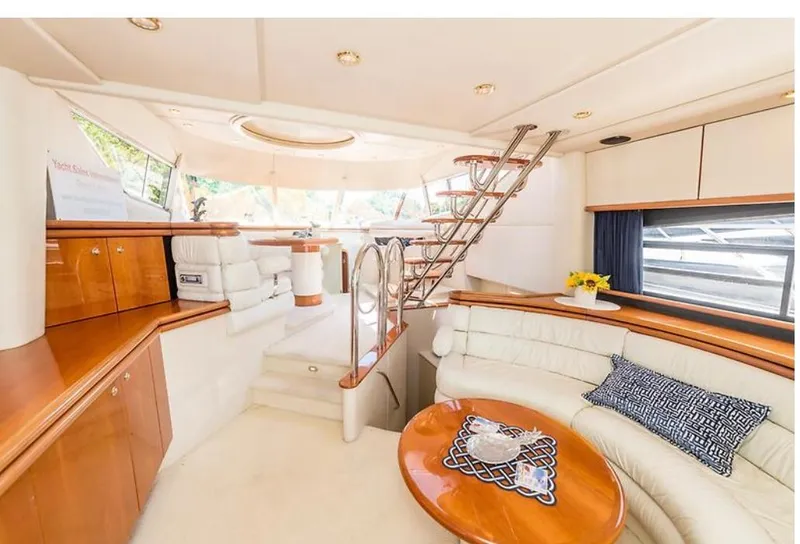 Slide: The Image of Luxurious interior of 1997 Sunseeker Manhattan yacht with elegant seating and modern design. - 21