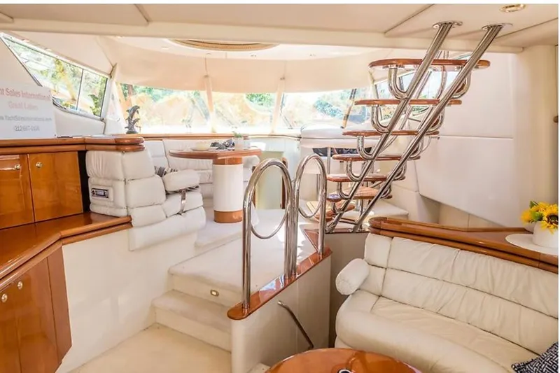 Slide: The Image of Luxurious interior of a 1997 Sunseeker MANHATTAN yacht with elegant seating and polished wood finishes. - 22