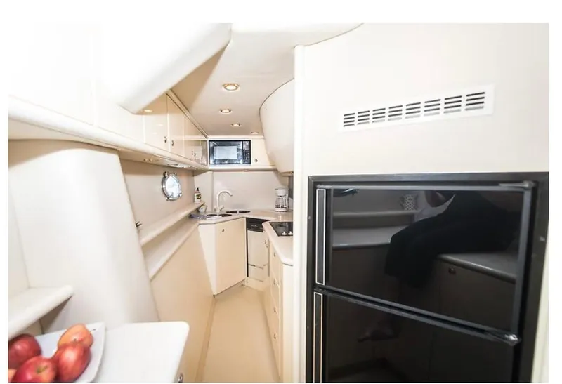 Slide: The Image of 1997 Sunseeker MANHATTAN yacht kitchen with modern appliances and sleek design. - 27