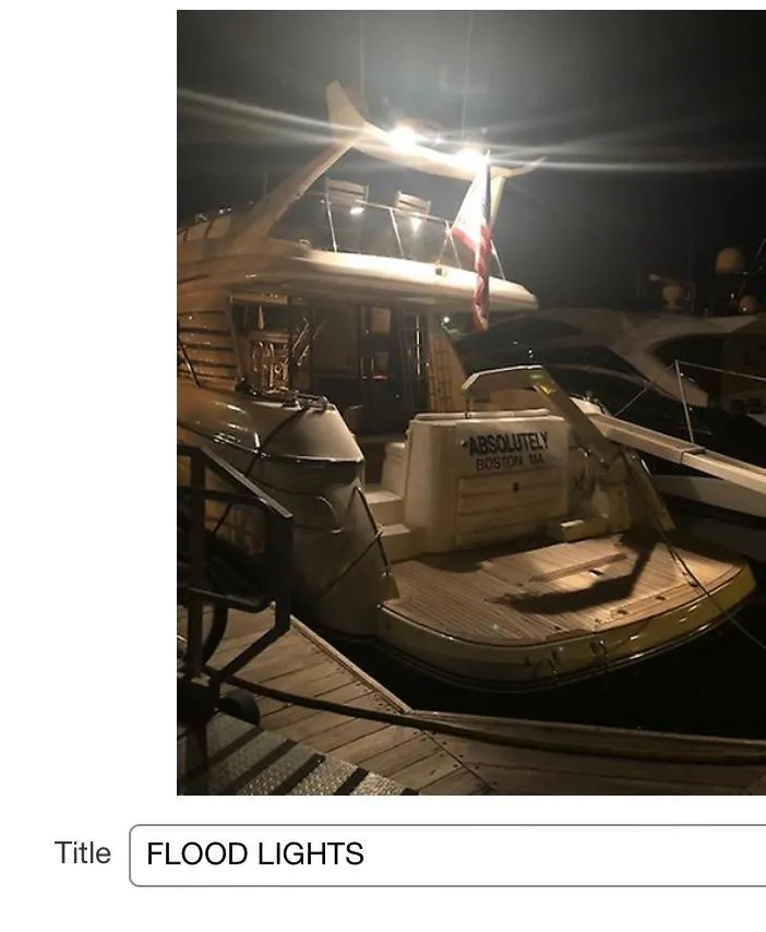 Slide: The Image of 1997 Sunseeker MANHATTAN yacht docked at night, illuminated by floodlights. - 28