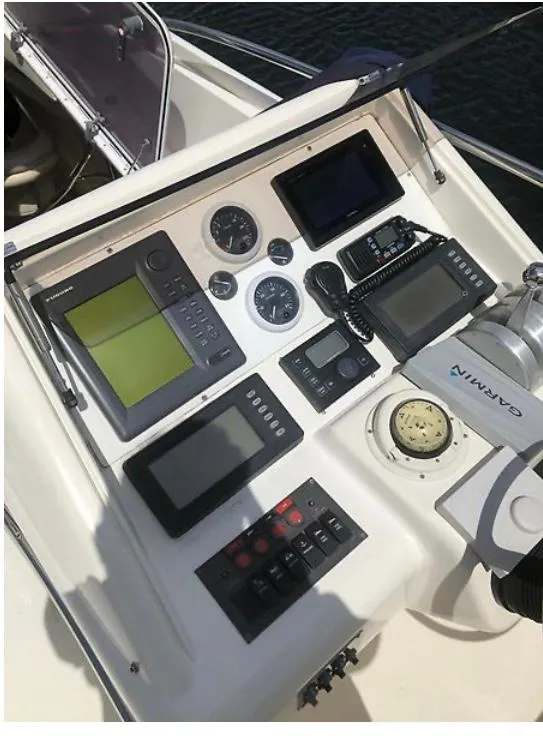 Slide: The Image of Control panel of a 1997 Sunseeker MANHATTAN yacht with navigation instruments. - 29