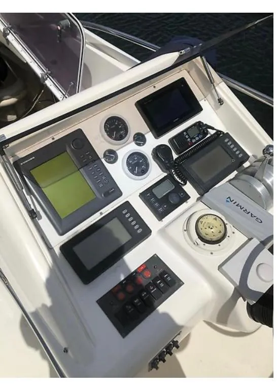 Slide: The Image of Control panel of a 1997 Sunseeker MANHATTAN yacht with navigation instruments. - 35