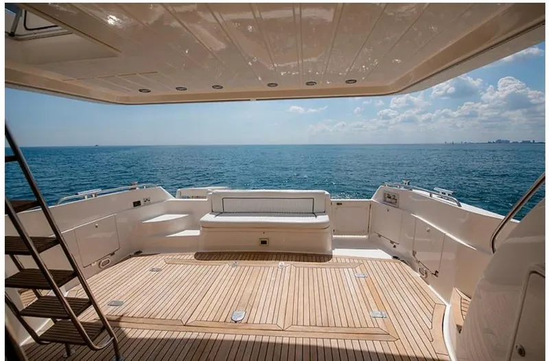 Slide: The Image of Sunseeker MANHATTAN 1997 yacht deck with ocean view, featuring wooden flooring and seating area. - 41