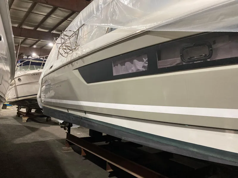 Slide: The Image of 1997 Sunseeker MANHATTAN yacht stored indoors, partially covered, side view. - 45