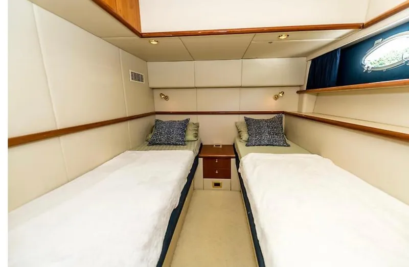 Slide: The Image of Twin cabin interior of 1997 Sunseeker MANHATTAN yacht with cozy beds and elegant decor. - 5