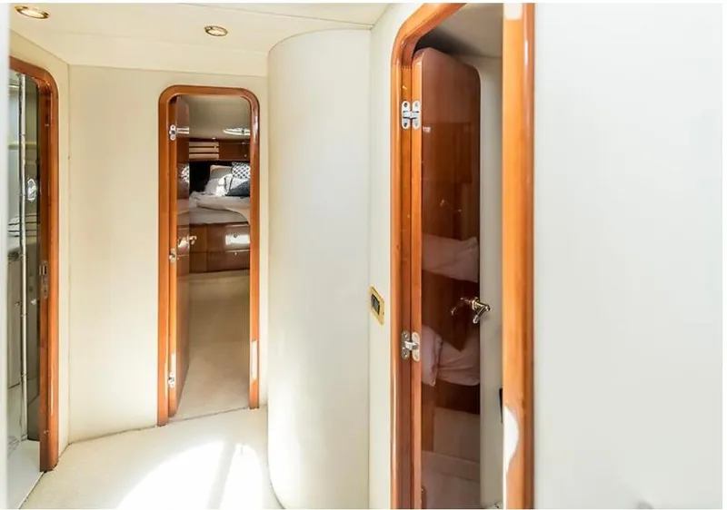 Slide: The Image of Interior hallway of 1997 Sunseeker MANHATTAN yacht with wooden doors and cozy cabin view. - 9