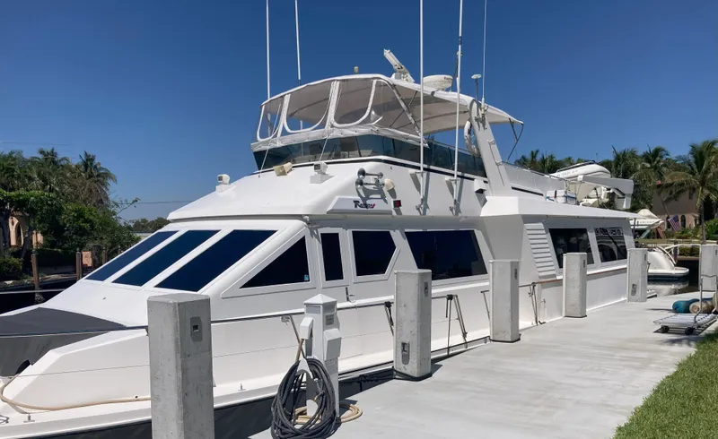 Slide: The Image of 1988 Viking 70 Cockpit Motor Yacht docked under clear blue sky. - 11