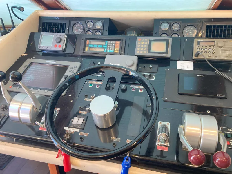 Slide: The Image of Control panel of a 1988 Viking 70 Cockpit Motor Yacht with navigation instruments. - 22