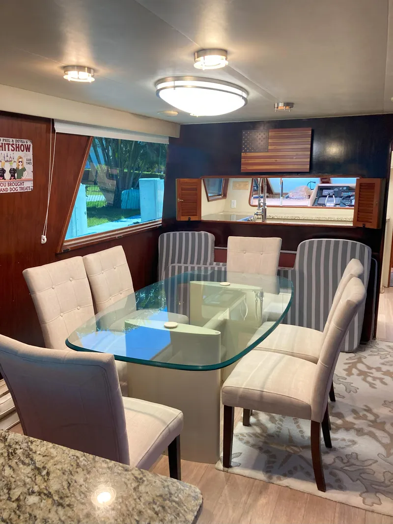 Slide: The Image of Elegant dining area inside a 1988 Viking 70 Cockpit Motor Yacht. - 30