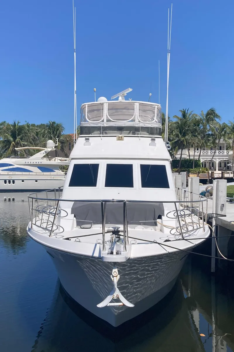Slide: The Image of 1988 Viking 70 Cockpit Motor Yacht docked in a marina. - 4