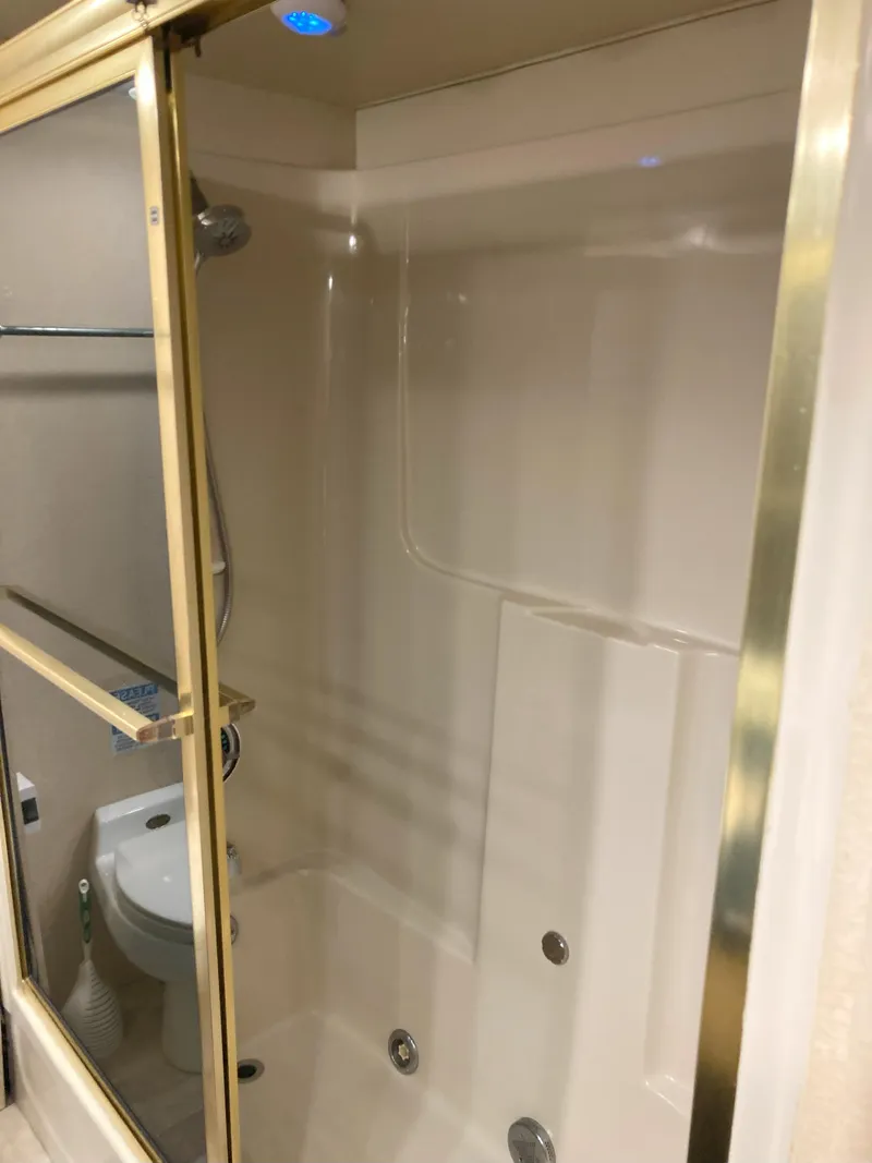 Slide: The Image of Bathroom shower and toilet in 1988 Viking 70 Cockpit Motor Yacht. - 47