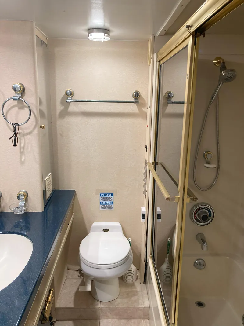 Slide: The Image of Bathroom in a 1988 Viking 70 Cockpit Motor Yacht with shower and toilet. - 48